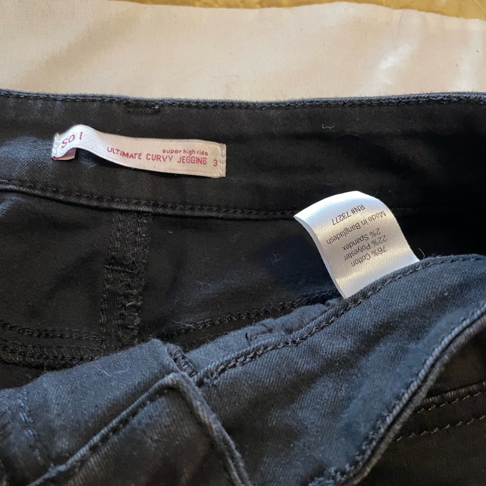 Super high rise black jeans with holes in knees